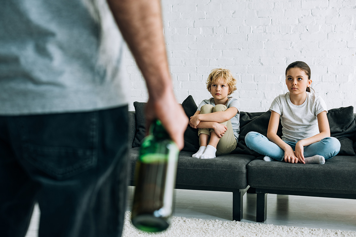 children looking at drinking dad wondering is addiction hereditary