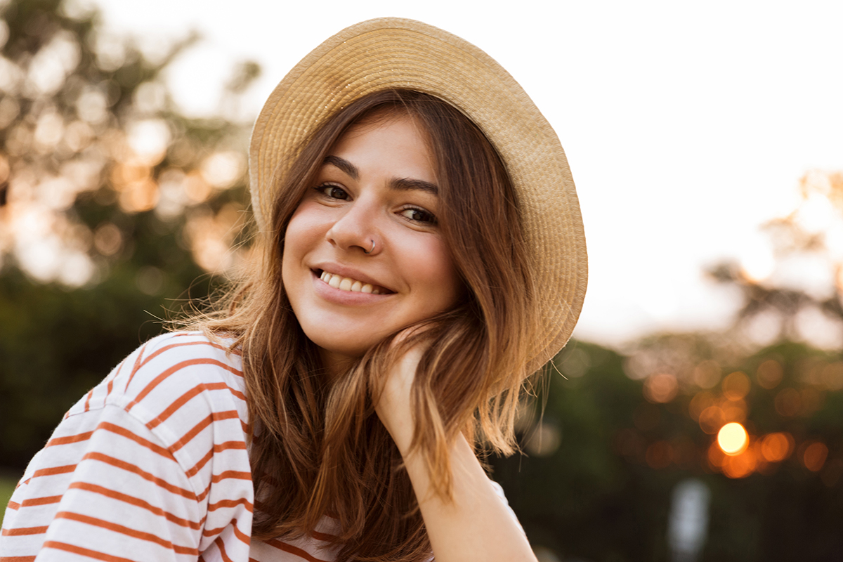 young woman happy after learning how to cope with unwanted emotions