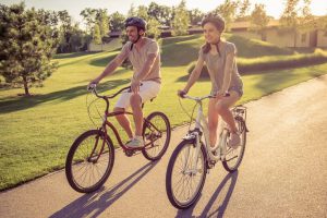 Man and woman riding bike