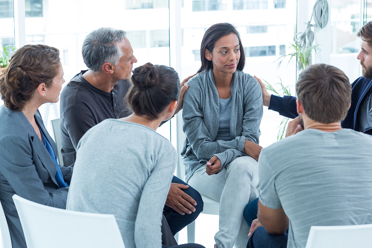 group learning about the 12 step program and addiction recovery