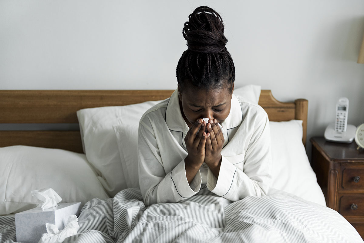 woman with a Compromised Immune System sick in bed