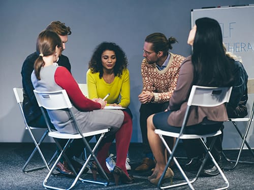 group learning how to support someone through detox