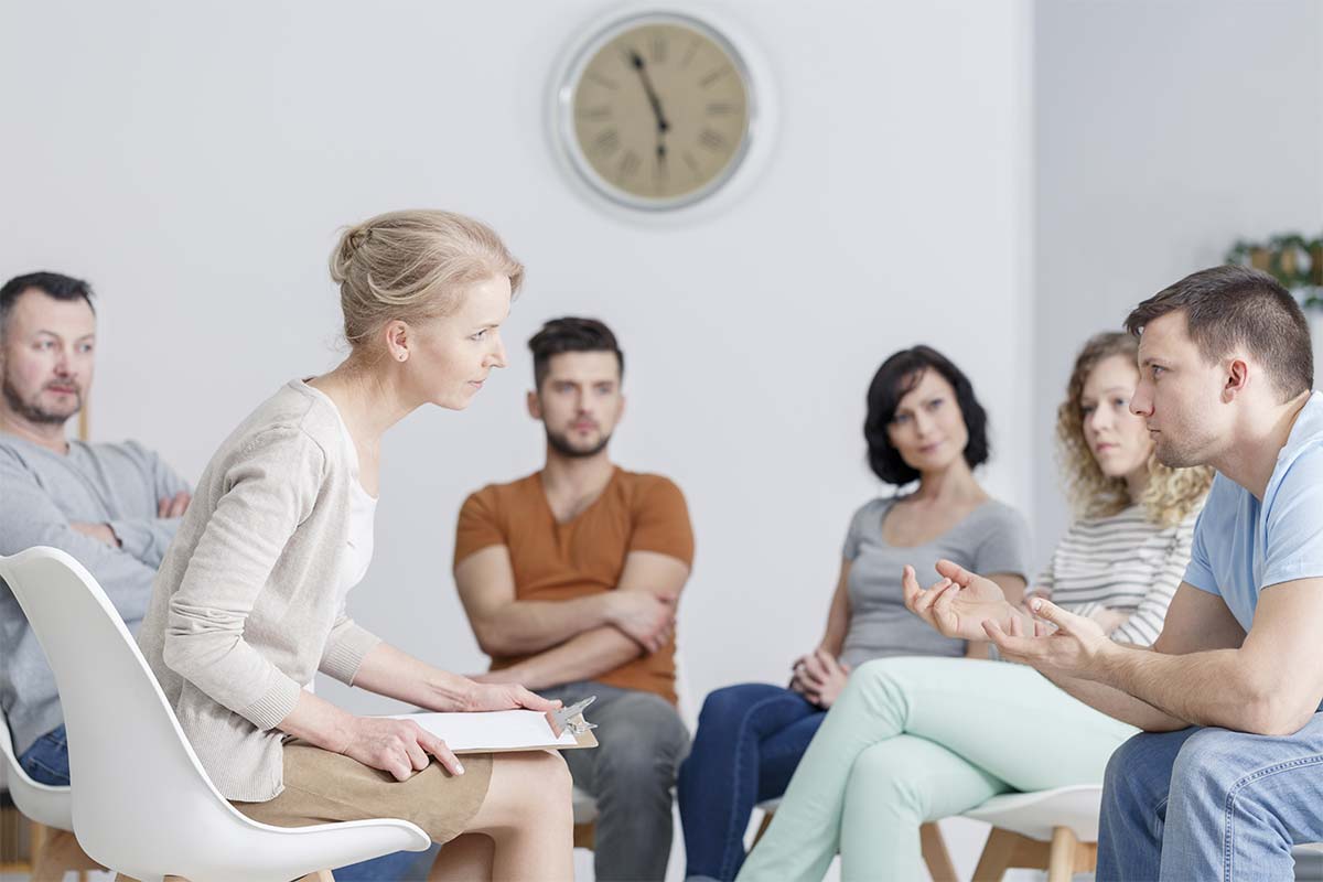 group participating in addiction counseling