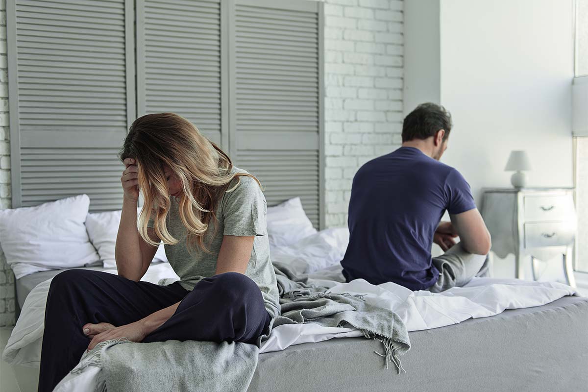 people turned away from each other in a toxic relationship