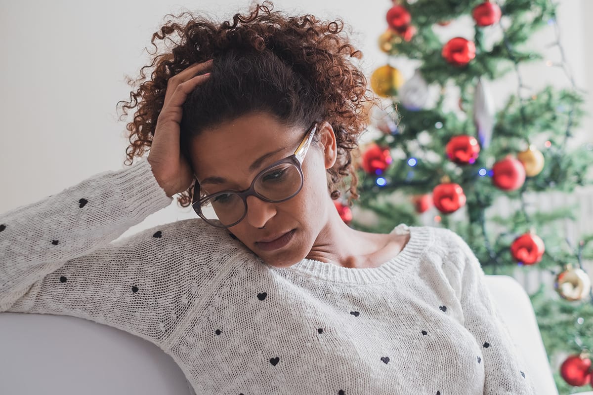 woman struggling with holiday addiction triggers