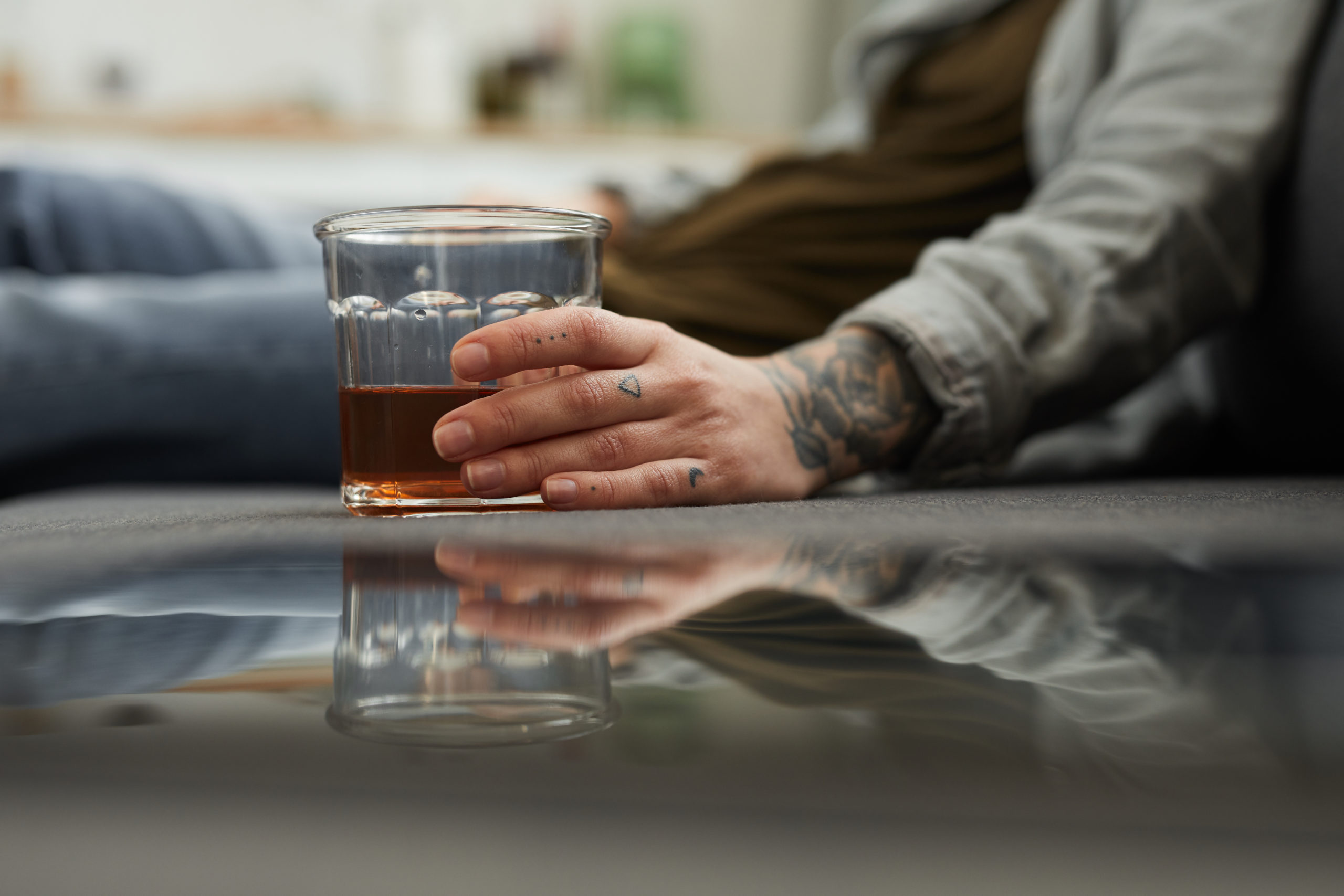 Woman holding glass of alcohol showing that alcohol relapse happens